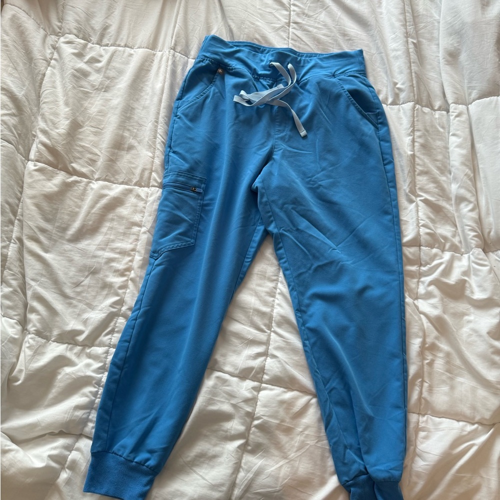 Size medium Figs scrubs- color is Capri Blue.